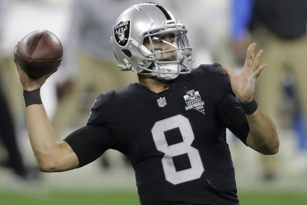 Las Vegas Raiders quarterback Marcus Mariota (8) looks to pass against the Los Angeles Chargers during the second half of an NFL football game, Thursday, Dec. 17, 2020, in Las Vegas. (AP Photo/Isaac Brekken) Las Vegas Raiders quarterback Marcus Mariota (8) looks to pass against the Los Angeles Chargers during the second half of an NFL football game, Thursday, Dec. 17, 2020, in Las Vegas. (AP Photo/Isaac Brekken)