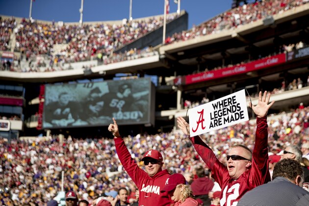 FILE - In this Nov. 9, 2019, file photo, Alabama fans cheer before the team's NCAA college football game against LSU at Bryant-Denny Stadium in Tuscaloosa, Ala. While professional sports leagues can ponder plans to isolate their athletes from the coronavirus and have them play in unusual, even secluded places, college sports have no such option. Pro sports leagues can get creative with solutions to save their multibillion-dollar businesses. College sports will take a slower road back. (AP Photo/Andrew Harnik, File)