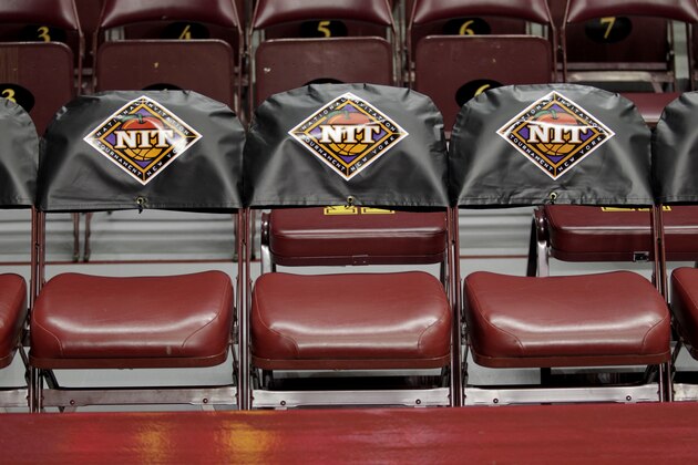 Players chairs are covered with NIT logos during the an NIT Tournament second round game between Minnesota and St. Mary's, Sunday, March 23, 2014, in Minneapolis. (AP Photo/Paul Battaglia)