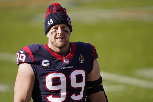 Houston Texans' J.J. Watt (99) watches before an NFL football game against the Chicago Bears, Sunday, Dec. 13, 2020, in Chicago. (AP Photo/Charles Rex Arbogast)