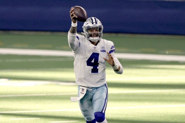 Dallas Cowboys quarterback Dak Prescott (4) pump fakes as he looks to throw a pass in the second half of an NFL football game against the New York Giants in Arlington, Texas, Sunday, Oct. 11, 2020. (AP Photo/Ron Jenkins)