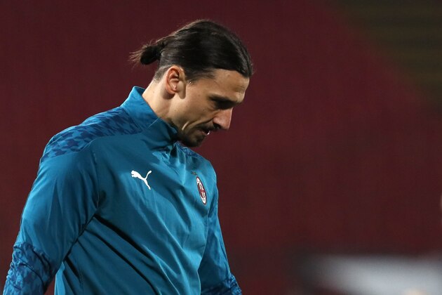 AC Milan's Zlatan Ibrahimovic looks on during warm up before the Europa League round of 32 first leg soccer match between Red Star and AC Milan at the Rajko Mitic Stadium in Belgrade, Serbia, Thursday, Feb. 18, 2021. (AP Photo/Darko Vojinovic)