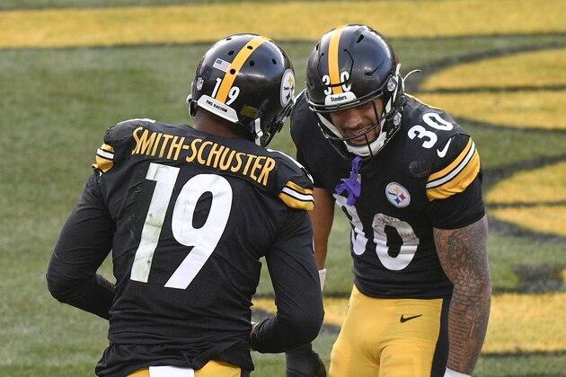 Pittsburgh Steelers wide receiver JuJu Smith-Schuster (19) celebrates with running back James Conner (30) after making a touchdown catch against the Indianapolis Colts during the second half of an NFL football game, Sunday, Dec. 27, 2020, in Pittsburgh. (AP Photo/Don Wright)