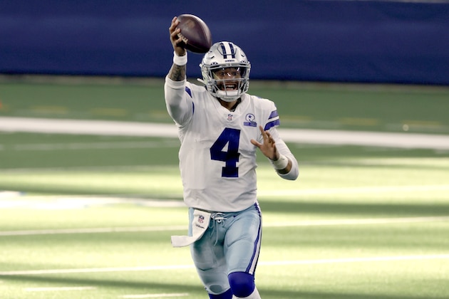 Dallas Cowboys quarterback Dak Prescott (4) pump fakes as he looks to throw a pass in the second half of an NFL football game against the New York Giants in Arlington, Texas, Sunday, Oct. 11, 2020. (AP Photo/Ron Jenkins)