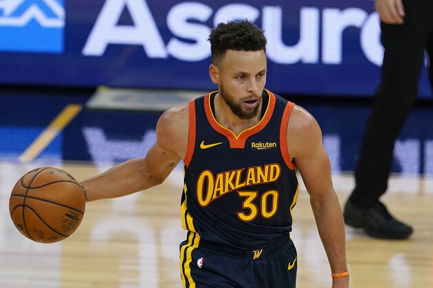 Golden State Warriors guard Stephen Curry (30) against the Miami Heat during an NBA basketball game in San Francisco, Wednesday, Feb. 17, 2021. (AP Photo/Jeff Chiu)
