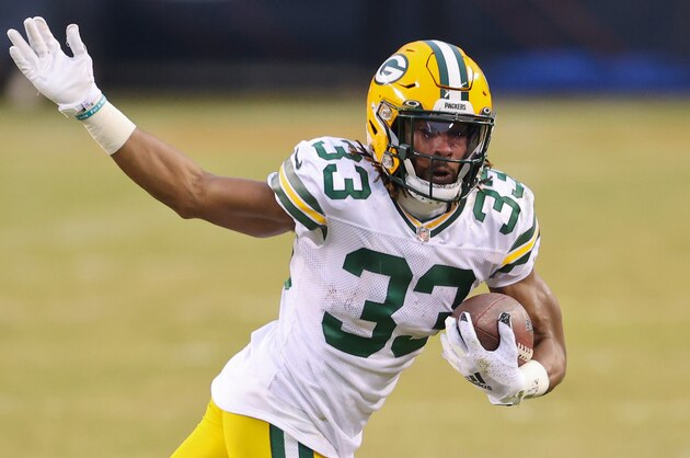 Green Bay Packers running back Aaron Jones (33) in action during the first half of an NFL football game against the Chicago Bears, Sunday, Jan. 3, 2021, in Chicago. (AP Photo/Kamil Krzaczynski)