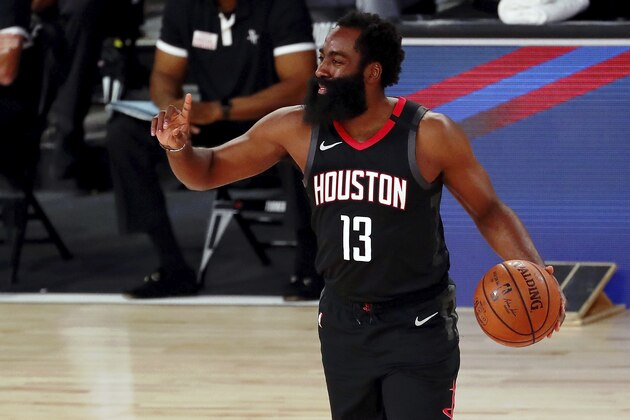 Houston Rockets guard James Harden (13) gestures to his team during the first half of an NBA basketball game against the Los Angeles Lakers, Thursday, Aug. 6, 2020, in Lake Buena Vista, Fla. (Kim Klement/Pool Photo via AP)