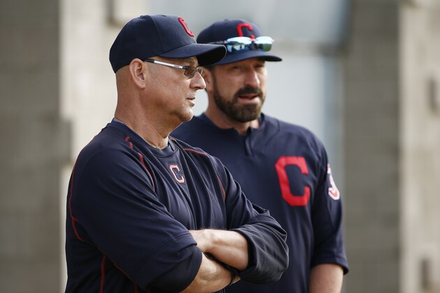 Cleveland Indians manager Terry Francona, left, and pitching coach Mickey Callaway talk before practice starts at the Indians baseball spring training facility Tuesday, Feb. 14, 2017, in Goodyear, Ariz. (AP Photo/Ross D. Franklin)