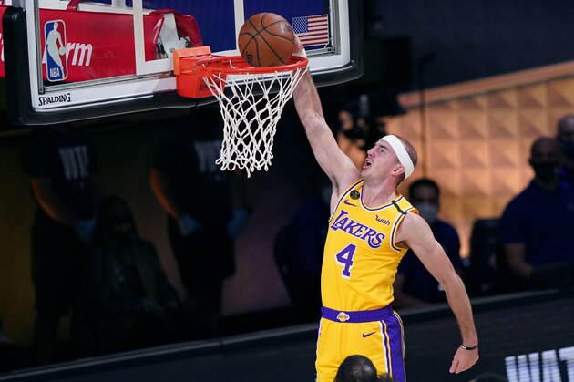 Los Angeles Lakers' Alex Caruso (4) dunks on a drive to the basket during the first half of Game 1 of basketball's NBA Finals Wednesday, Sept. 30, 2020, in Lake Buena Vista, Fla. (AP Photo/Mark J. Terrill)