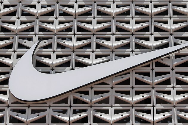 FILE - This Aug. 8, 2017, file photo shows the Nike logo at a store in Miami Beach, Fla. Walmart-owned Jet.com will soon sell Nike products on its site as it seeks to catch up with Amazon ahead of the holiday shopping season. (AP Photo/Alan Diaz, File)