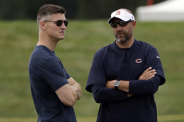 FILE - In this July 26, 2019, file photo, Chicago Bears head coach Matt Nagy, right, talks with general manager Ryan Pace during NFL football training camp in Bourbonnais, Ill. The Bears and every other team around the NFL are staring at a season like no other because of the COVID-19 pandemic. Veterans started reporting to camps this week. But instead of jumping right into the grind, they're taking a slower approach  (AP Photo/Nam Y. Huh, File)