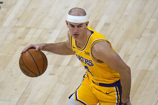 Los Angeles Lakers guard Alex Caruso (4) brings the ball up court in the second half during an NBA basketball game against the Utah JazzWednesday, Feb. 24, 2021, in Salt Lake City. (AP Photo/Rick Bowmer)