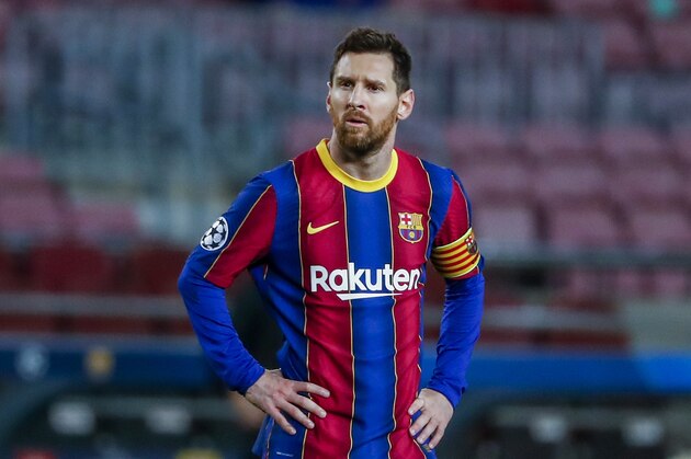 Barcelona's Lionel Messi looks on during the Champions League round of 16, first leg soccer match between FC Barcelona and Paris Saint-Germain at the Camp Nou stadium in Barcelona, Spain, Tuesday, Feb. 16, 2021. (AP Photo/Joan Monfort)