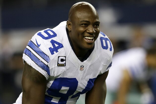 Dallas Cowboys defensive end DeMarcus Ware (94) smiles as he talks with teammates while stretching during warm ups before an NFL football game against the Washington Redskins, Sunday, Oct. 13, 2013, in Arlington, Texas. (AP Photo/Tim Sharp)