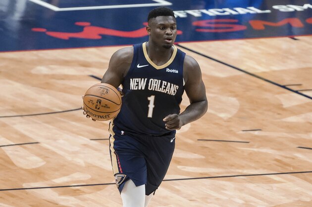 New Orleans Pelicans forward Zion Williamson (1) drives down court against the Phoenix Suns in the first quarter of an NBA basketball game in New Orleans, Wednesday, Feb. 3, 2021. (AP Photo/Derick Hingle)