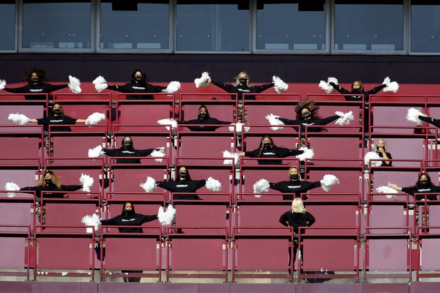FILE - Washington Football Team cheerleaders perform before an NFL football game against the New York Giants in Landover, Md., in this Sunday, Nov. 8, 2020, file photo. The Washington Football Team will not have cheerleaders for the 2021 season as part of an organizational rebranding. Washington hired Petra Pope, who managed the