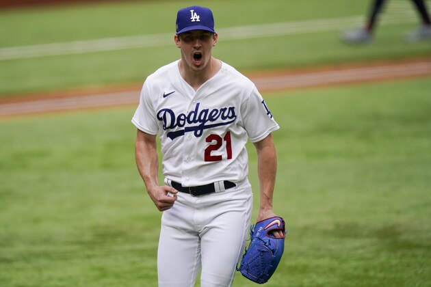 Los Angeles Dodgers starting pitcher Walker Buehler celebrates the end of the top of the second inning against the Atlanta Braves in Game 6 of a baseball National League Championship Series Saturday, Oct. 17, 2020, in Arlington, Texas. (AP Photo/Eric Gay)