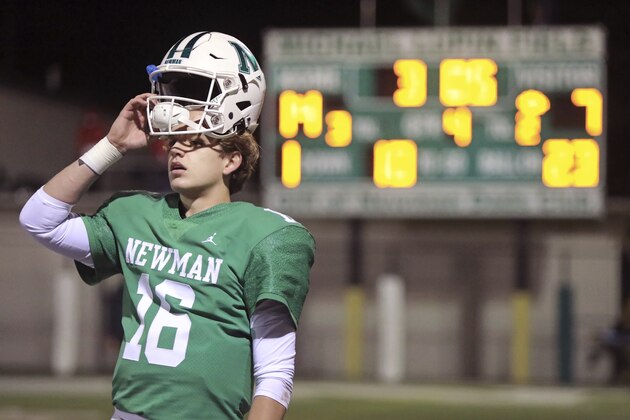 Newman High School quarterback Arch Manning (16) watches the extra point from the sideline after the winning touchdown, during a playoff game against Catholic High of New Iberia, in New Orleans, Friday, Dec. 4, 2020. (AP Photo/Ted Jackson)