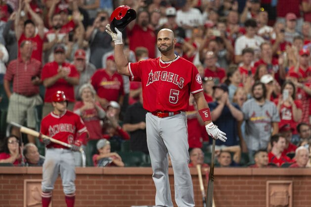 Los Angeles Angels' Albert Pujols tips his cap to the crowd before his final at bat of the night during the ninth inning of a baseball game against the Los Angeles Angels Sunday, June 23, 2019, in St. Louis. (AP Photo/L.G. Patterson) Los Angeles Angels' Albert Pujols tips his cap to the crowd before his final at bat of the night during the ninth inning of a baseball game against the Los Angeles Angels Sunday, June 23, 2019, in St. Louis. (AP Photo/L.G. Patterson)