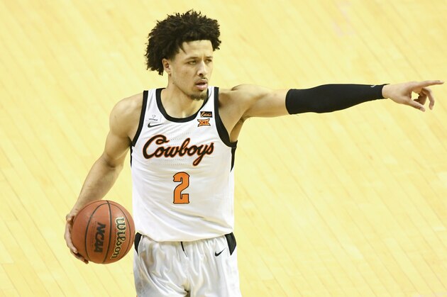 Oklahoma State guard Cade Cunningham (2)points during an NCAA college basketball game Monday, March. 1, 2021, in Stillwater, Okla. (AP Photo/Brody Schmidt)