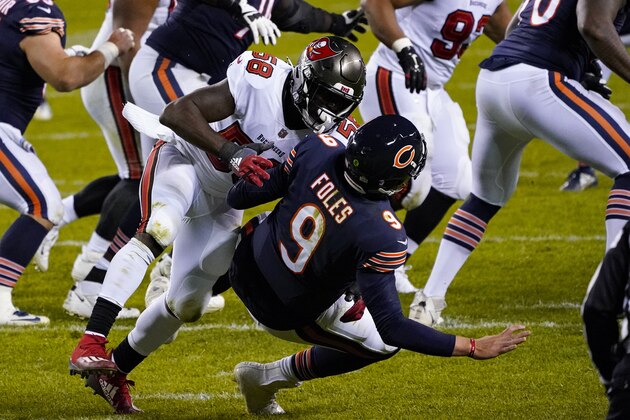 Tampa Bay Buccaneers outside linebacker Shaquil Barrett (58) hits Chicago Bears quarterback Nick Foles (9) in the second half of an NFL football game in Chicago, Thursday, Oct. 8, 2020. Barrett was called for roughing the passer on the play. (AP Photo/Charles Rex Arbogast)