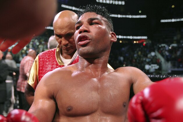 Yuriorkis Gamboa stands along the ropes after being defeated by Gervonta Davis for the WBA lightweight boxing bout, Sunday, Dec. 29, 2019, in Atlanta. Davis won the title by a 12th round TKO. (AP Photo/Tami Chappell)