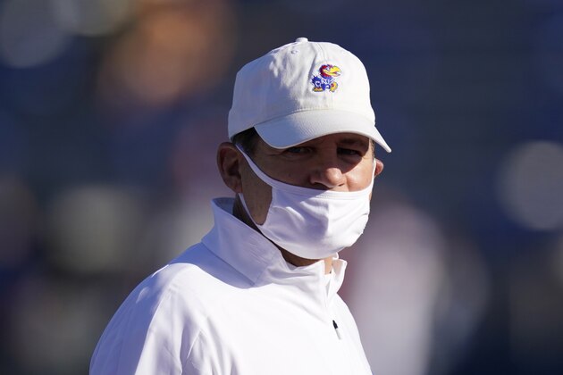Kansas head coach Les Miles watches his team warm up before an NCAA college football game against Iowa State in Lawrence, Kan., Saturday, Oct. 31, 2020. (AP Photo/Orlin Wagner)