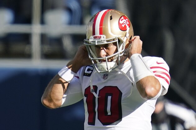 San Francisco 49ers quarterback Jimmy Garoppolo adjusts his helmet beore an NFL football game against the Seattle Seahawks, Sunday, Nov. 1, 2020, in Seattle. (AP Photo/Elaine Thompson)