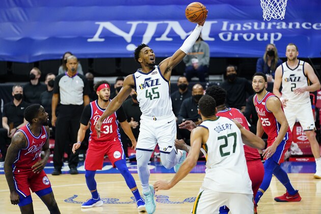 Utah Jazz's Donovan Mitchell (45) goes up for a shot during the second half of an NBA basketball game against the Philadelphia 76ers, Wednesday, March 3, 2021, in Philadelphia. (AP Photo/Matt Slocum)
