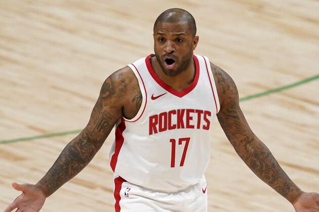 Houston Rockets' P.J. Tucker gestures at an official during an NBA basketball game against the Dallas Mavericks in Dallas, Saturday, Jan. 23, 2021. (AP Photo/Tony Gutierrez)