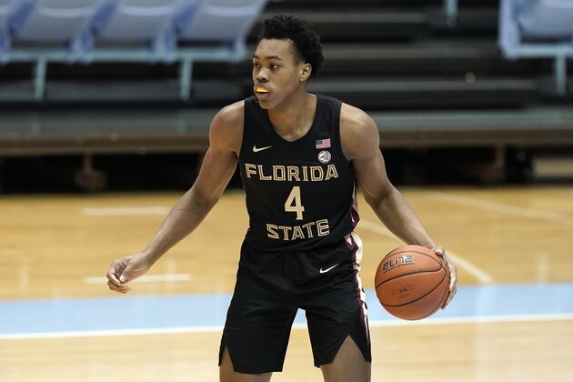Florida State guard Scottie Barnes (4) dribbles against North Carolina during the second half of an NCAA college basketball game in Chapel Hill, N.C., Saturday, Feb. 27, 2021. (AP Photo/Gerry Broome)