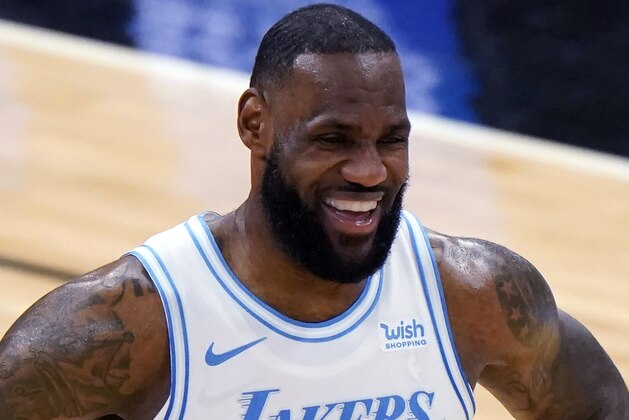 FILE - In this Jan. 23, 2021, file photo, Los Angeles Lakers forward LeBron James smiles during the second half of an NBA basketball game against the Chicago Bulls in Chicago. The Associated Press asked eight of the greatest current and former champions, including James, from seven different sports to find out what impressed them most about Tom Brady.(AP Photo/Nam Y. Huh)