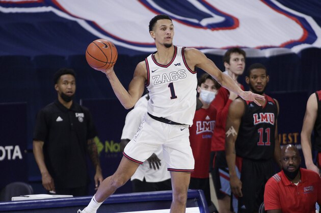 Gonzaga guard Jalen Suggs passes the ball during the second half of an NCAA college basketball game against Loyola Marymount in Spokane, Wash., Saturday, Feb. 27, 2021. (AP Photo/Young Kwak)