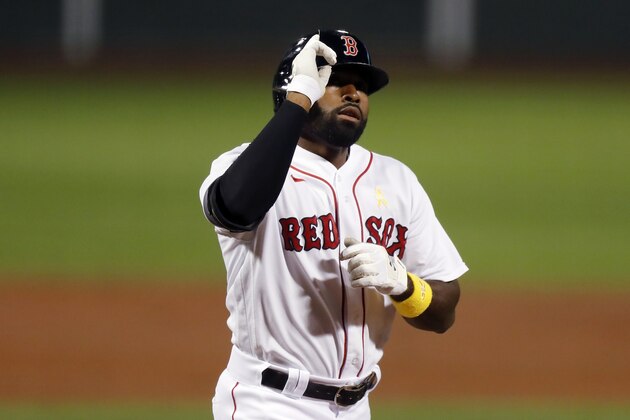 Boston Red Sox's Jackie Bradley Jr. celebrates his two-run home run during the second inning of a baseball game against the Toronto Blue Jays, Saturday, Sept. 5, 2020, in Boston. (AP Photo/Michael Dwyer)