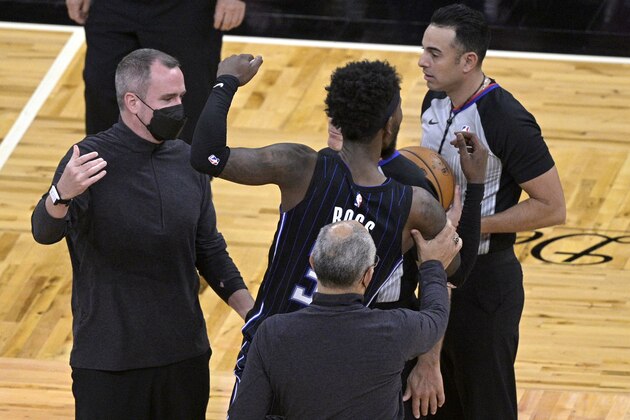 Orlando Magic guard Terrence Ross (31) is kept away from official Ray Acosta, right, after the team's loss to the Atlanta Hawks in an NBA basketball game Wednesday, March 3, 2021, in Orlando, Fla. (AP Photo/Phelan M. Ebenhack)