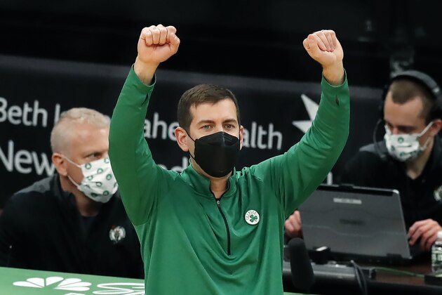 Boston Celtics' head coach Brad Stevens signals during the first half of an NBA basketball game against the Washington Wizards, Sunday, Feb. 28, 2021, in Boston. (AP Photo/Michael Dwyer)