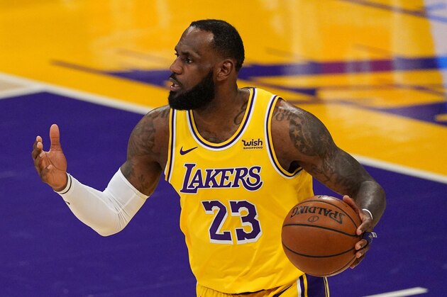 Los Angeles Lakers forward LeBron James dribbles during the first half of an NBA basketball game against the Miami Heat Saturday, Feb. 20, 2021, in Los Angeles. (AP Photo/Mark J. Terrill)