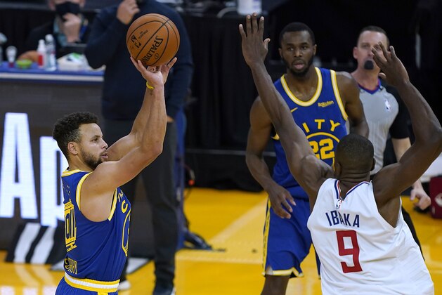 Golden State Warriors guard Stephen Curry (30) takes a three-point shot over Los Angeles Clippers forward Serge Ibaka (9) during the second half of an NBA basketball game in San Francisco, Friday, Jan. 8, 2021. (AP Photo/Tony Avelar)