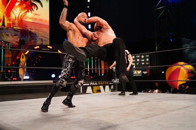 Jon Moxley attacking Karl Anderson. Jon Moxley attacking Karl Anderson.