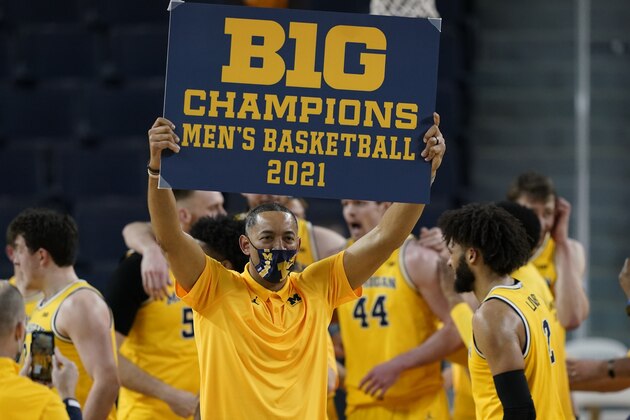 Michigan coach Juwan Howard holds a championship sign after after the team's win over Michigan State in an NCAA college basketball game Thursday, March 4, 2021, in Ann Arbor, Mich. (AP Photo/Carlos Osorio) Michigan coach Juwan Howard holds a championship sign after after the team's win over Michigan State in an NCAA college basketball game Thursday, March 4, 2021, in Ann Arbor, Mich. (AP Photo/Carlos Osorio)