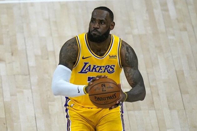 Los Angeles Lakers forward LeBron James (23) brings the ball up court in the second half during an NBA basketball game against the Utah Jazz Wednesday, Feb. 24, 2021, in Salt Lake City. (AP Photo/Rick Bowmer)