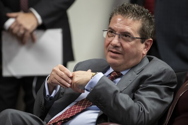 FILE - In this Thursday, Jan. 2, 2020, file photo, Washington Redskins owner Dan Snyder listens to head coach Ron Rivera during a news conference at the team's NFL football training facility, in Ashburn, Va. A person familiar with the situation tells The Associated Press the NFL has taken over the independent investigation into workplace conduct within the Washington Football Team. (AP Photo/Alex Brandon, File)