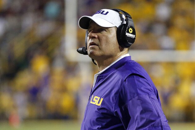 FILE - This Sept. 17, 2016 file photo shows LSU head coach Les Miles watching from the sideline in the second half of an NCAA college football game against Mississippi State in Baton Rouge, La.  Miles spent national signing day doing television on ESPNU, Wednesday, Feb. 1, 2017, as his son, Ben Miles,  officially became a college football player. (AP Photo/Gerald Herbert, file)