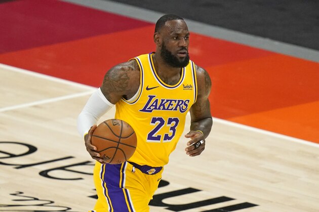 Los Angeles Lakers forward LeBron James (23) brings the ball up court in the second half during an NBA basketball game against the Utah Jazz Wednesday, Feb. 24, 2021, in Salt Lake City. (AP Photo/Rick Bowmer)