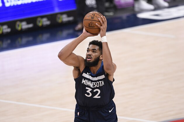 Minnesota Timberwolves center Karl-Anthony Towns (32) in action during the second half of an NBA basketball game against the Washington Wizards, Saturday, Feb. 27, 2021, in Washington. (AP Photo/Nick Wass)