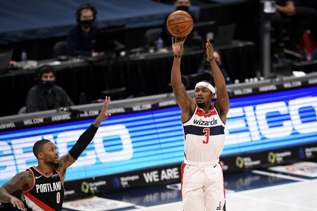 Washington Wizards guard Bradley Beal (3) shoots against Portland Trail Blazers guard Damian Lillard (0) during the first half of an NBA basketball game, Tuesday, Feb. 2, 2021, in Washington. (AP Photo/Nick Wass)