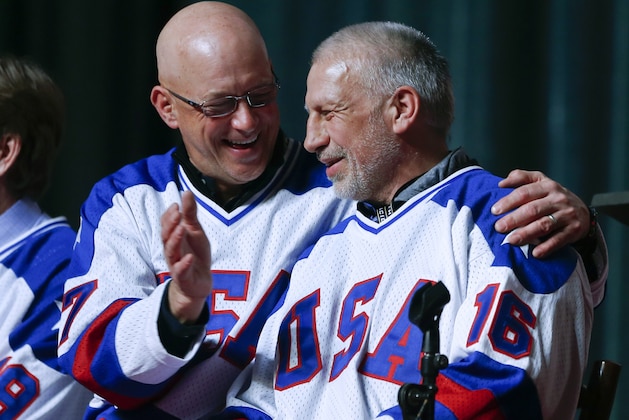 Jack O'Callahan, left, and Mark Pavelich of the 1980 U.S. ice hockey team talk during a