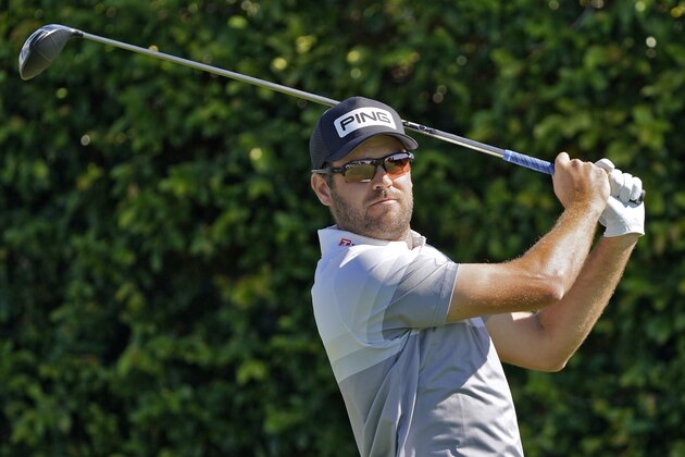 Corey Conners, of Canada, watches his tee shot on the ninth hole during the second round of the Arnold Palmer Invitational golf tournament Friday, March 5, 2021, in Orlando, Fla. (AP Photo/John Raoux)