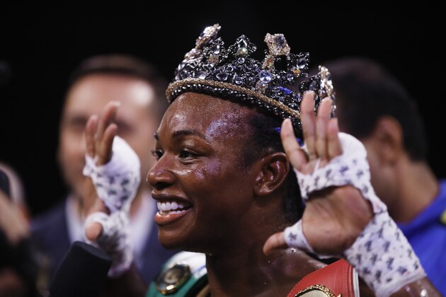 Claressa Shields poses for photographs after defeating Ivana Habazin in their 154-pound title boxing bout in Atlantic City, N.J., Friday, Jan. 10, 2020. (AP Photo/Matt Rourke)