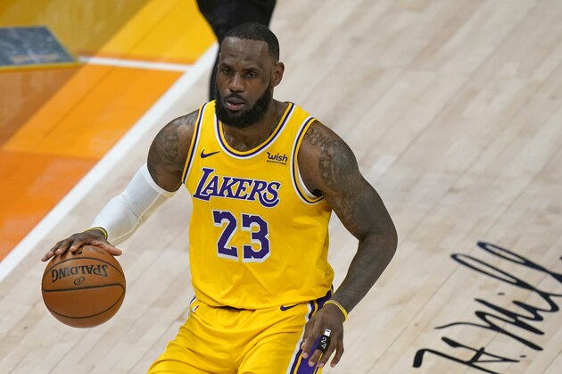 Los Angeles Lakers forward LeBron James (23) brings the ball up court in the second half during an NBA basketball game against the Utah Jazz Wednesday, Feb. 24, 2021, in Salt Lake City. (AP Photo/Rick Bowmer)